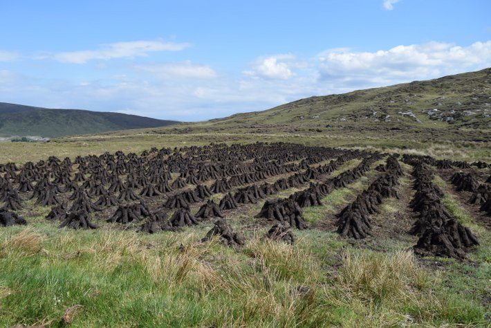 Drying Peat sen on tour of Ireland with Ancient Ireland Tourism